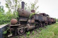 Old and rusty steam locomotive abandoned on an lost place train station