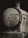 Old rusty steam locomotive with door and chimney Royalty Free Stock Photo