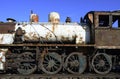 Old rusty steam locomotive on railway tracks Royalty Free Stock Photo