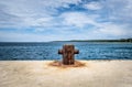 Old rusty steel mooring bollard pole on a pier. Royalty Free Stock Photo