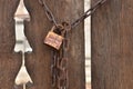 Closed rusty steel padlock hanging on wooden door Royalty Free Stock Photo