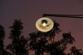 Old rusty street lamp against beautiful sunset sky background