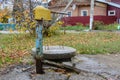 Old rusty street water standpipe. Old vintage water standpipe installed outdoors Royalty Free Stock Photo