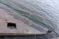 Old rusty sunken pier in the water on the territory of the river port. Royalty Free Stock Photo