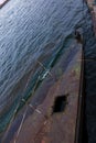 Old rusty sunken pier in the water on the territory of the river port. Royalty Free Stock Photo