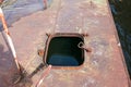 Old rusty sunken pier in the water on the territory of the river port. Royalty Free Stock Photo