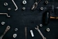 Old, rusty tools lying on a wooden table. Hammer, chisel, metal scissors, wrench, chisel. Royalty Free Stock Photo