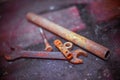 Old rusty tools lying on a wooden table.