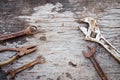 Old rusty tools on old wood background. wrench on wooden. rustic styles. Royalty Free Stock Photo