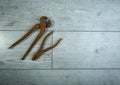 old rusty tools on a white wooden background Royalty Free Stock Photo