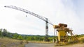 Old rusty tower crane in a abandoned industrial area