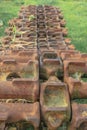 An old rusty track from a tank abandoned in a field