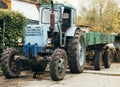 Old rusty tractor. Agricultural machine dilapidated front of the farm. Old iron. Tractor waiting to be scrapped. Abandoned farm