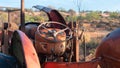 Old, rusty tractor on a junk yard in the outback
