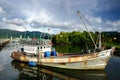 Old rusty traditional Thai fishing boat on Koh Chang island, Thailand.