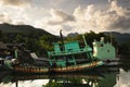 Old rusty traditional Thai fishing boat on Koh Chang island, Thailand.