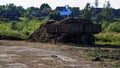 Old rusty trailer with manure fertilizer stands in field to fertilize land before sowing