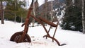 An old rusty tricycle in the winter forest