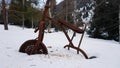 An old rusty tricycle in the winter forest