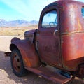 Old Rusty Truck With Desert Ranch and Mountains