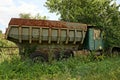 Old Rusty Truck Standing In Green Grass And Vegetation
