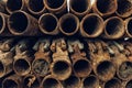 Old rusty used scaffolding pipes on construction site