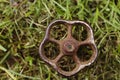 Old rusty valve in the grass Royalty Free Stock Photo