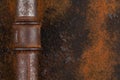 Old rusty valve pipes on rusty metal wall background Royalty Free Stock Photo