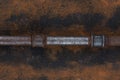 Old rusty valve pipes on rusty metal wall background Royalty Free Stock Photo