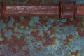 Old rusty valve pipes on rusty metal wall background Royalty Free Stock Photo