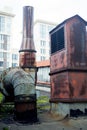 Old rusty vents on the roof of an abandoned building.Rust Royalty Free Stock Photo