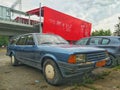 Old rusty veteran scrap classic blue hatchback car Ford Granada 2.0L parked right side parked