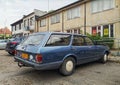 Old rusty veteran scrap classic blue hatchback car Ford Granada 2.0L parked right side parked