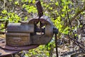 Old and rusty vice on the site of a former freight yard.