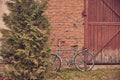 Old rusty vintage bicycle leaning against a brick wall. Royalty Free Stock Photo