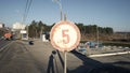 An old rusty vintage 5 km h speed limit road sign