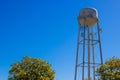 Old Rusty Water Tank Tower Above Tree Line Royalty Free Stock Photo