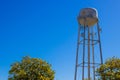 Old Rusty Water Tank Tower Above Treeline Royalty Free Stock Photo