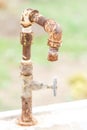 Old rusty water tap in the garden. Macro shot Royalty Free Stock Photo