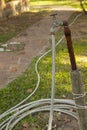 Old Rusty Water Tap With Hose In Garden