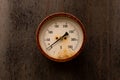 Old rusty water thermometer on black metal background Royalty Free Stock Photo