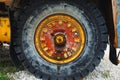 Old rusty wheel of haul truck