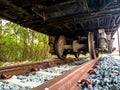 Old rusty wheel of retires train on the inactive rail track Royalty Free Stock Photo