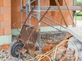 Old rusty wheelbarrow while building a house Royalty Free Stock Photo