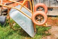 Old rusty wheelbarrow cart in the garden Royalty Free Stock Photo