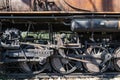 Old rusty wheels of the steam locomotive and the elements of the drive Royalty Free Stock Photo