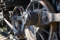 Old rusty wheels of the steam locomotive and the elements of the drive Royalty Free Stock Photo