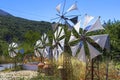 Old rusty windmills on the field. Agriculture in Greece Royalty Free Stock Photo