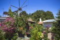 Old rusty windmills on the field. Agriculture in Greece Royalty Free Stock Photo