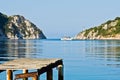 Old rusty wooden dock at sunny morning, Porto Koufo harbor Royalty Free Stock Photo